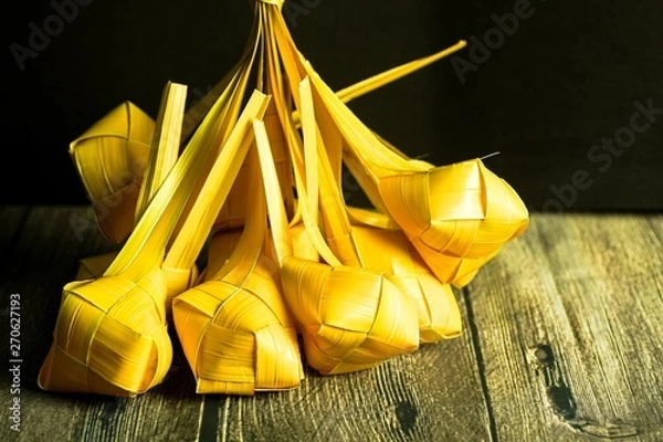 Fototapeta Ketupat (rice dumpling) is a local delicacy during the festive season in South East Asia, especially during eid fitri. Ketupat, a natural rice casing made from young coconut leaves for cooking rice 