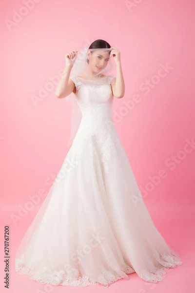 Fototapeta Beautiful asian bride portrait in pink studio