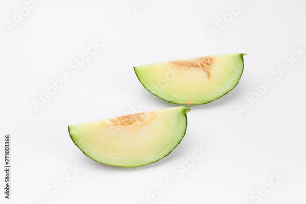 Fototapeta Sliced green cantaloupe melon isolated on white background