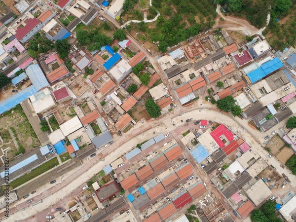 Fototapeta Aerial view  top view of small village with little courtyard and farm style house in the country side area of Huaibei next the mountain, China