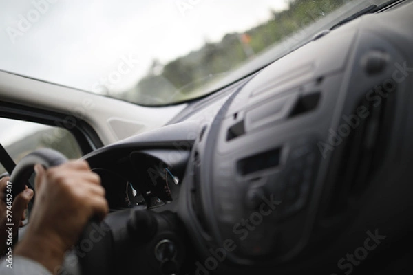 Fototapeta Businessman driving car