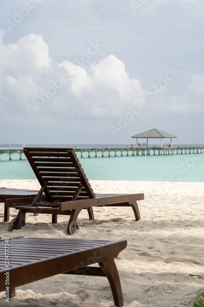 Obraz Beautiful beach with chaise lounge with ocean landscape