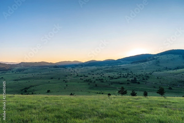 Fototapeta Amazing mountain landscape with colorful vivid sunset on clear sky, natural outdoor travel background