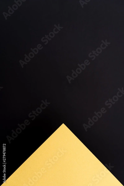 Fototapeta Blank gold and black geometric triangular vertical background. Layout for business, posters and banners.