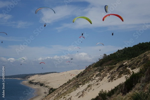 Fototapeta France. Parasailing of the Dunes du PIlat at the Atlantique coast