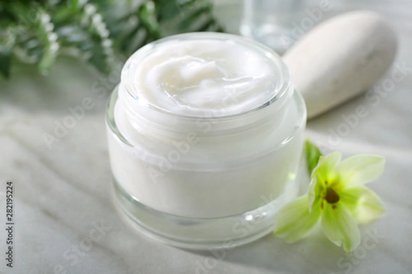 Fototapeta Jar of body cream on white table