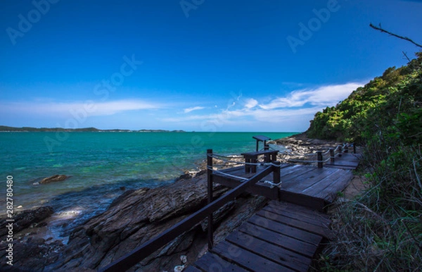 Fototapeta The natural background of the wooden bridge admiring the seaside scenery, facilitating walking, blurred breezes, natural beauty