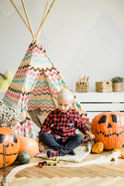 Fototapeta Halloween boy with pumpkin.