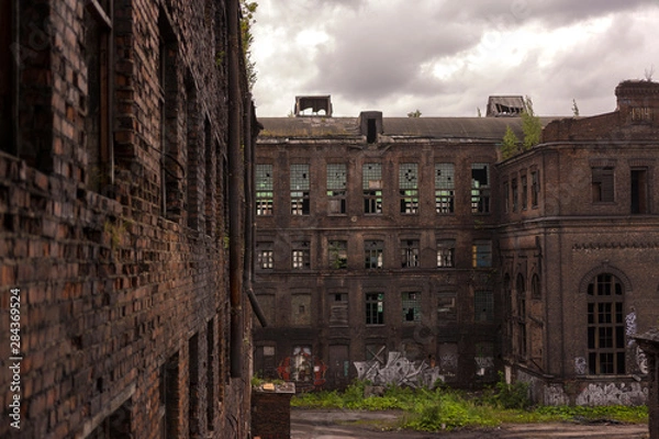 Fototapeta View of the old factory buildings. Old loft-style building.