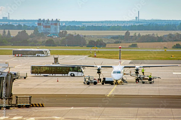 Fototapeta International airport with airplane aeroplane aircraft and passenger