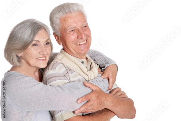 Fototapeta Portrait of happy senior couple hugging on white background