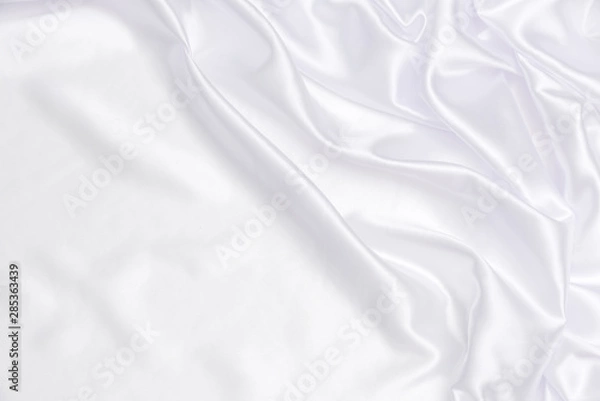 Fototapeta Crumpled of white satin for abstract and design, Detail and grooved of fabric for background and textured