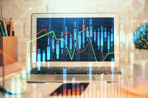 Fototapeta Stock market graph on background with desk and personal computer. Multi exposure. Concept of financial analysis.