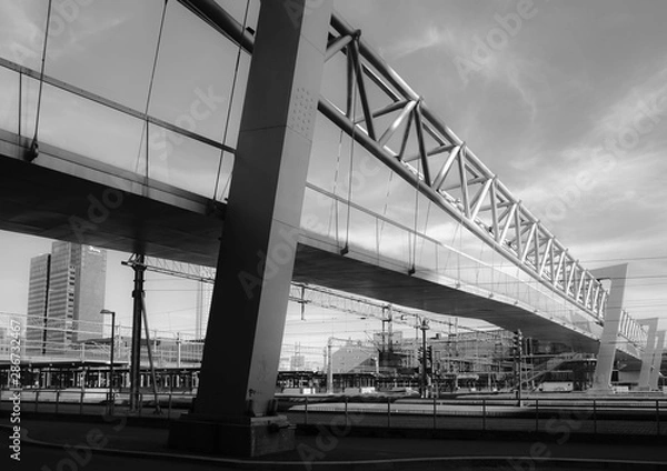 Fototapeta Bridge across the train tracks at the Barcode neighbourhood in Oslo, Norway