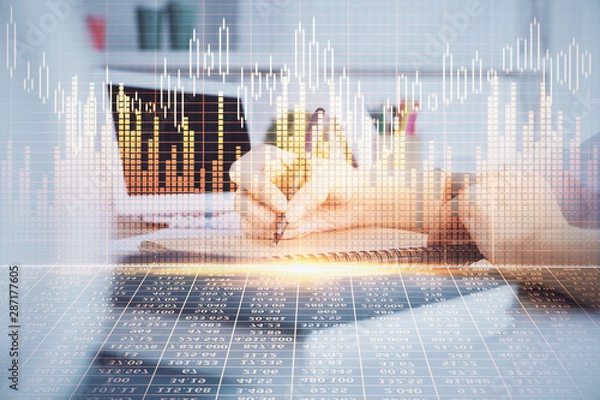 Fototapeta Financial graph displayed on woman's hand taking notes background. Concept of research. Double exposure