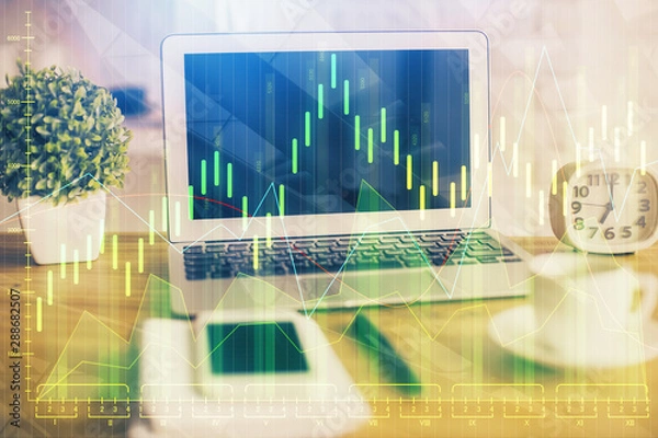 Fototapeta Multi exposure of graph and financial info and work space with computer background. Concept of international online trading.