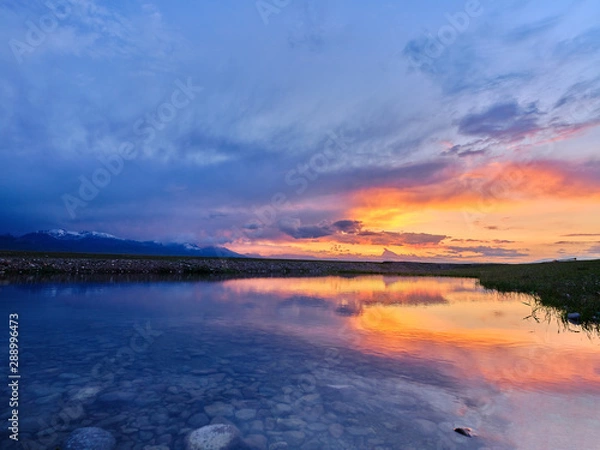 Fototapeta sunset time of human grassland in xinjiang