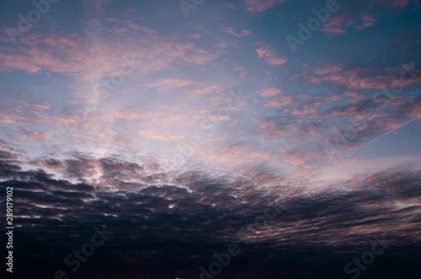 Fototapeta Beautiful blue sky with white clouds and natural colors at sunset