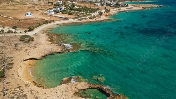 Fototapeta Aerial drone top view photo of beautiful volcanic rocky seascape with turquoise waters, Koufonisi island, small Cyclades, Greece