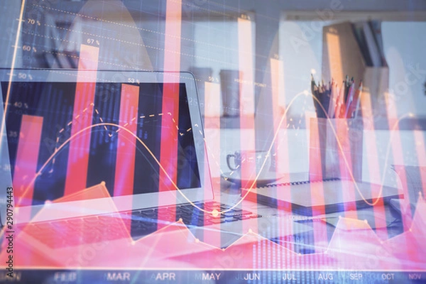 Fototapeta Stock market graph on background with desk and personal computer. Multi exposure. Concept of financial analysis.