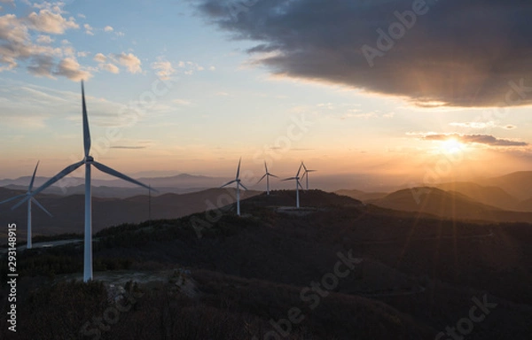 Fototapeta wind turbines at sunset