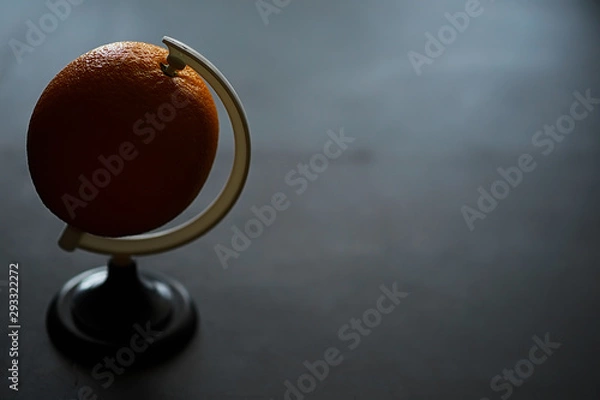 Fototapeta Orange citrus fruit on a stone table. Orange background.