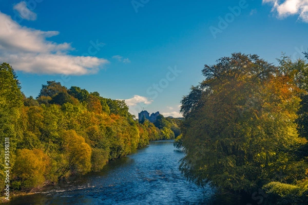 Obraz Autumn Leaves in the Forest on the Banks of the River Teith With Doune Castle in the Background