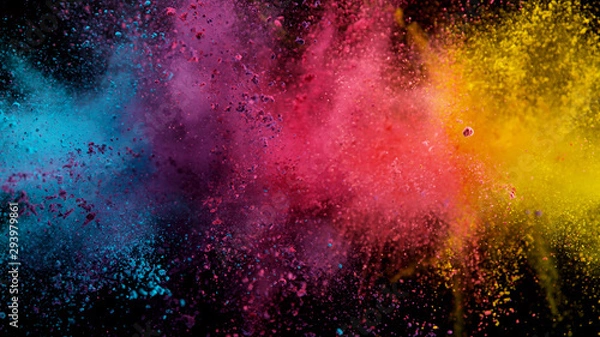 Fototapeta Explosion of colored powder on black background