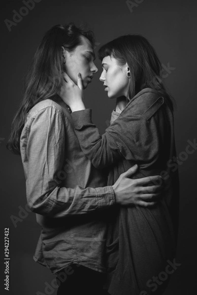 Fototapeta Portrait of young beautiful couple. Studio. Black and white.