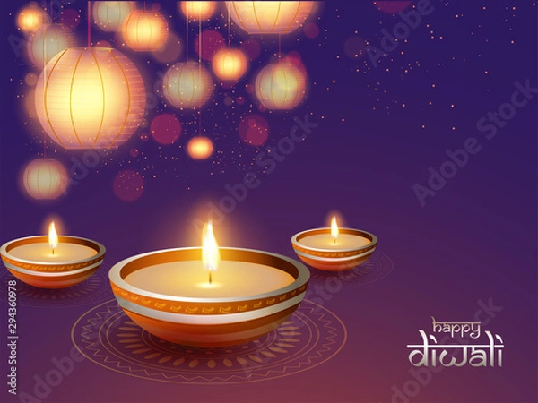 Fototapeta Illuminated oil lamps (Diya) on shiny background decorated with hanging paper lanterns (lamps) and blurred lighting effect for Diwali festival celebration.