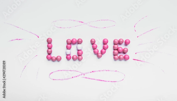 Fototapeta Word LOVE made of rouge balls on color background