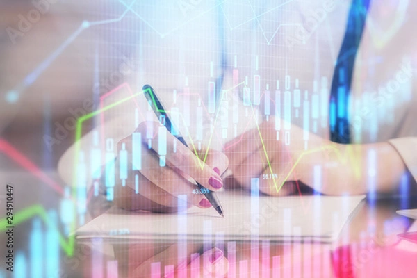 Fototapeta Double exposure of hands making notes with forex chart huds. Stock market concept.