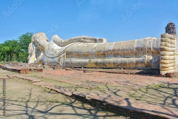 Fototapeta Large 300-year-old reclining Buddha statue in Ayutthaya, Thailand