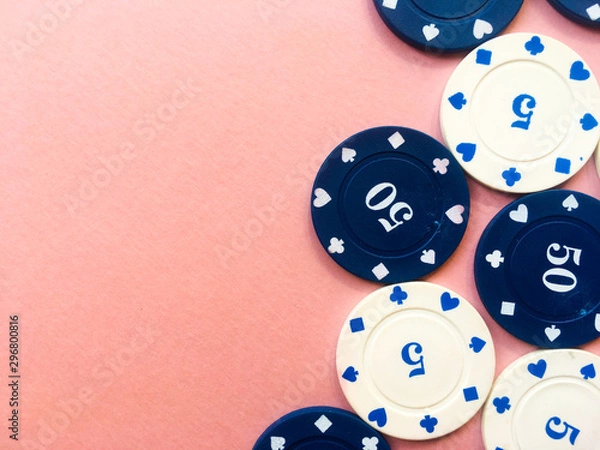 Fototapeta Poker chips on a pink background. Place for text.