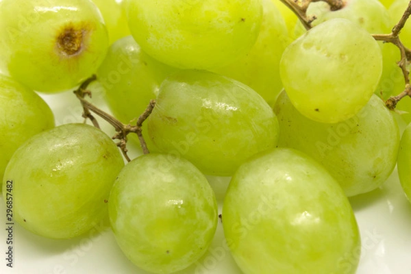 Fototapeta This is a photograph of Green Grapes isolated on a White background