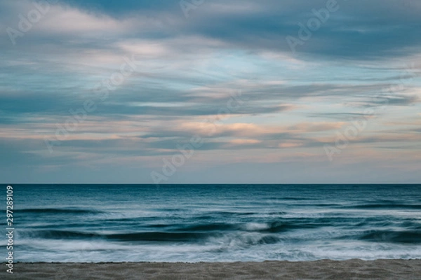 Fototapeta Long exposure photography of the sea with clouds at sunset