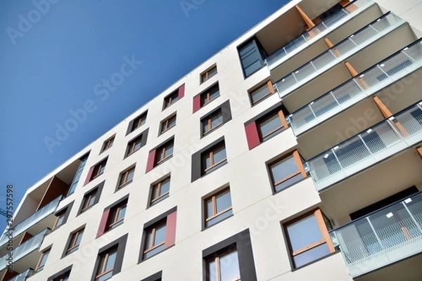 Fototapeta Modern apartment buildings on a sunny day with a blue sky. Facade of a modern apartment building