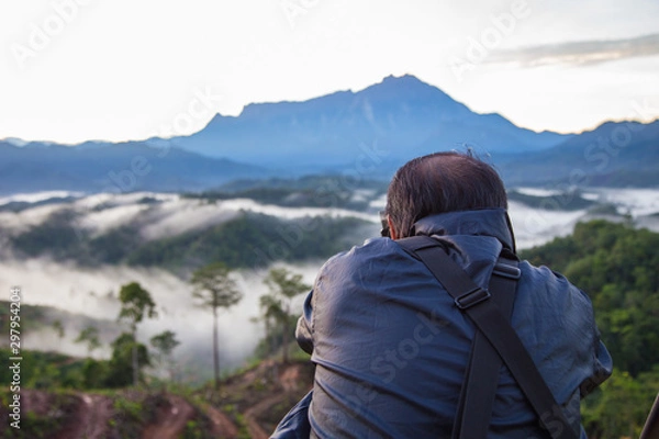 Fototapeta Asia Photographer man taking picture of beautiful Mount Kinabalu, Sabah, Borneo with nature environment 