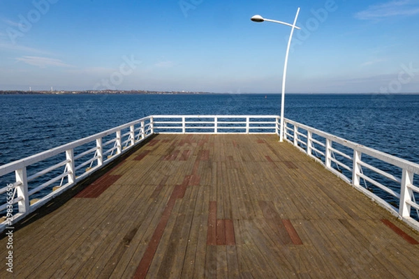 Fototapeta A small pier over the bay in Central Europe. A small bridge over the sea.