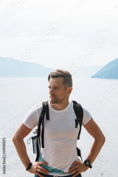 Fototapeta Man portrait on Teletskoye lake in Altai mountains, Siberia, Russia. Beauty summer day.