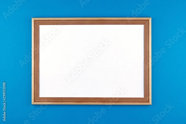 Fototapeta wooden frame on blue background