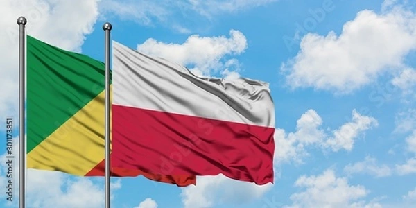 Obraz Republic Of The Congo and Poland flag waving in the wind against white cloudy blue sky together. Diplomacy concept, international relations.