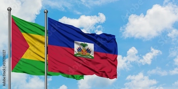 Fototapeta Sao Tome And Principe and Haiti flag waving in the wind against white cloudy blue sky together. Diplomacy concept, international relations.