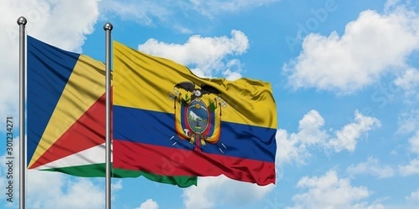 Fototapeta Seychelles and Ecuador flag waving in the wind against white cloudy blue sky together. Diplomacy concept, international relations.