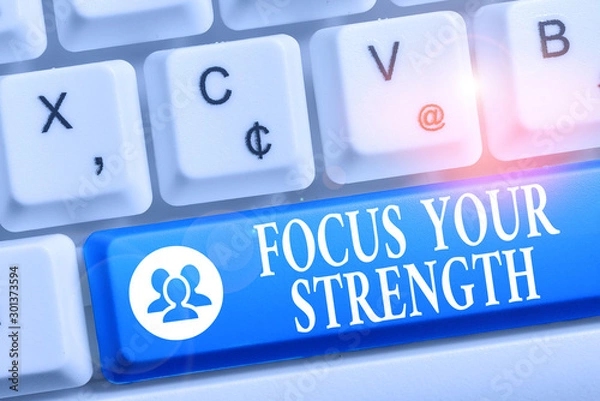 Fototapeta Word writing text Focus Your Strength. Business photo showcasing Improve skills work on weakness points think more White pc keyboard with empty note paper above white background key copy space