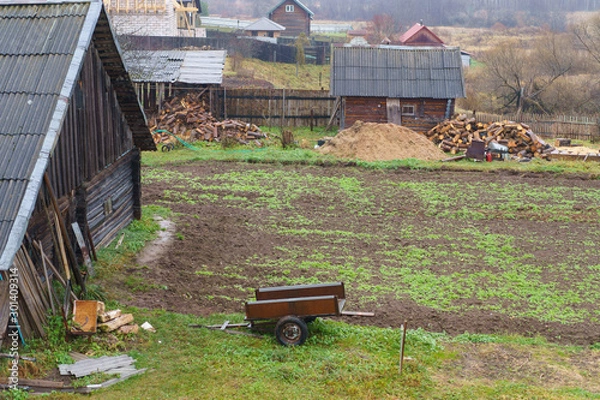 Fototapeta Russian countryside in overcast autumn day, Farming concepts and lifestyles.