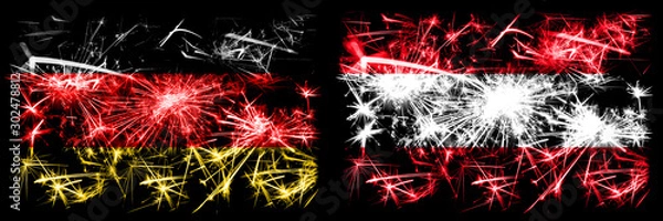 Fototapeta Germany, German vs Austria, Austrian New Year celebration travel sparkling fireworks flags concept background. Combination of two abstract states flags.