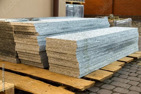 Fototapeta Piles of granite marble slabs.  Stone sheets for decorative construction.