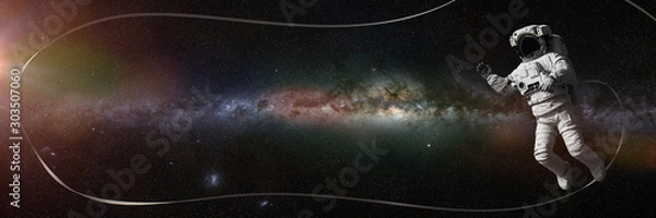 Fototapeta astronaut in front of the Milky Way galaxy