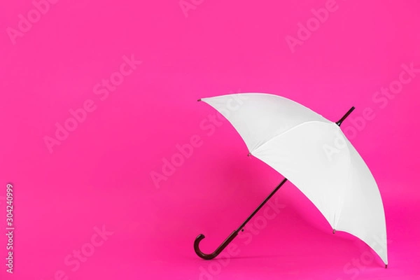 Fototapeta Beautiful white umbrella on pink background. Space for text